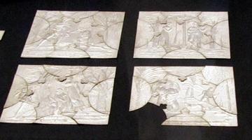 Silver jewelry squares cut into “puzzle pieces” that fit together