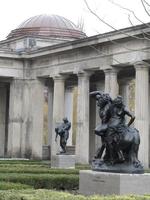 Two black metal sculptures in outside courtyard of gallery