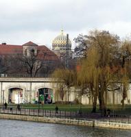 View across river; blue-domed building in background.