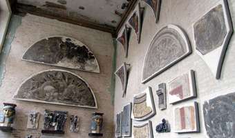 Brick wall with painted Greek/Roman arches attached to it