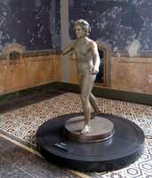 Gold statue of young boy