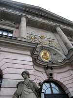 Statue of woman and inset gold medallion above entrance to German History Museum