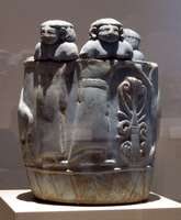 Egyptian blue round box with human heads at top; 750 BCE
