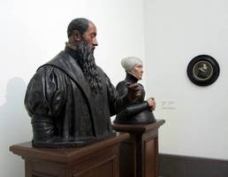 Busts of man and woman in Dutch Renaissance clothing