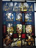 Stained glass showing process of minting coins