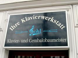 Sign for Gohl Piano repair; “G” is in the shape of a treble clef