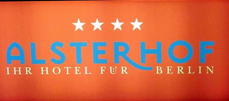 Sign with umlaut dots vertically stacked inside U