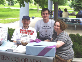 three people sitting at table