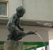 fountain of boy playing with goose