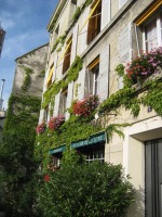a building with plants on side