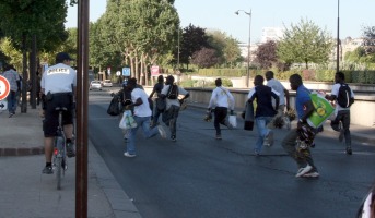 back view of fleeing vendors