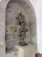 slightly abstract sculpture of a muscular man