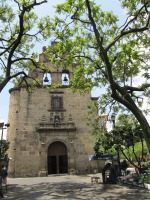part of church with two bells in tower