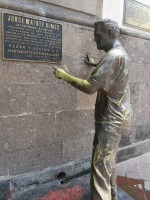 engineer pushing against building