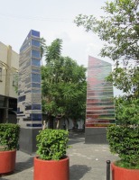 two glass columns; one blue, one red and green