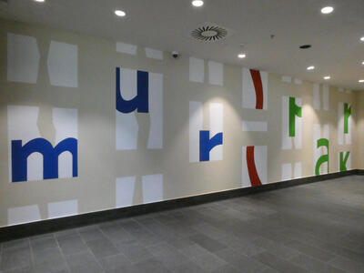 Wall at Murpark shopping center. The word murpark is spelled out, but each letter is only partially drawn.