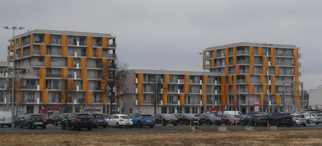 apartment building with orange panels on facade