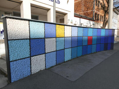 multicolored stucco curved wall