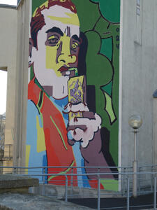 wall painting of man drinking from juice box