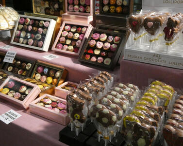 assorted boxes of chocolates and chocolate lollipops