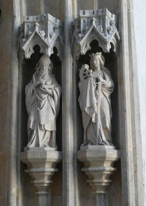 niche sculptures of bishop and queen