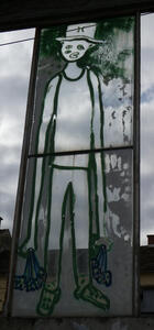 graffiti man with top hat and very long arms