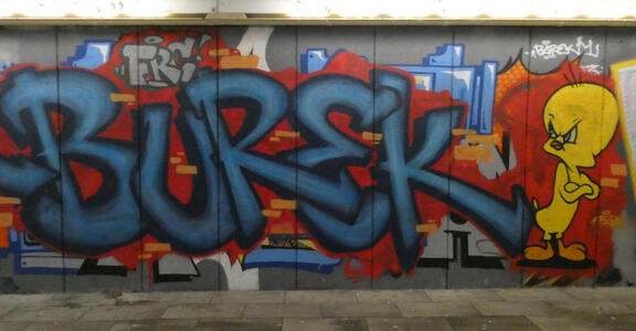 Graffiti text BUREK at left; at right, Tweety bird looking angrily at text.