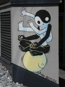 Two men with a combined yin-yang symbol for a head balancing on a yellow sphere with a smiley face