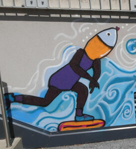 Person with a fish head on a skateboard (cartoonish drawing)