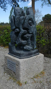 abstract metal sculpture of two people intertwined