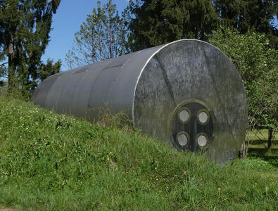 side view large cylindrical sculpture