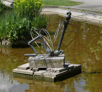 metal sculpture of dragonflies