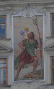 Renaissance-style painting of man holding a sapling, the Christ child is on his shoulder.