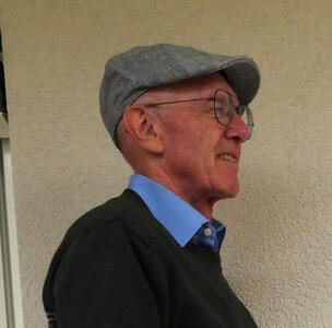 me in a gray European-style cap, side view