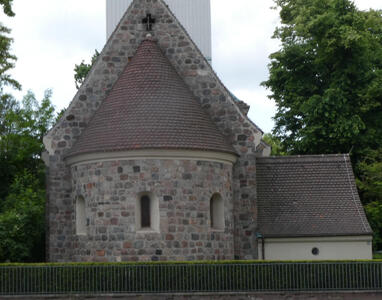 conical roof on cylindrical brick building