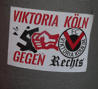 Sticker for Viktoria Köln gegen Rechts, showing a red fist smashing a broken swastika.