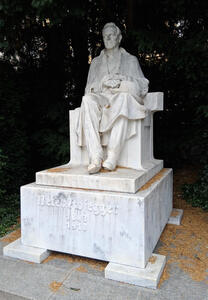 Statue of seated Peter Rosegger (1843-1918)