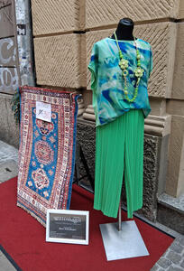colorful dress near afghan carpet