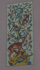 Deer eating leaves from a tree with birds nesting in it