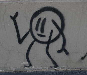 stick figure person with spherical head