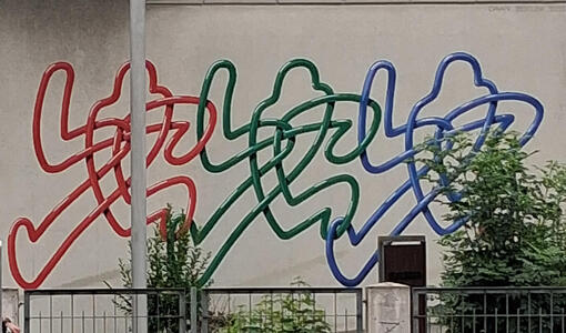 line drawing in red, green, and blue of three people walking