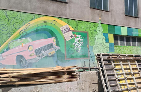 Pink car, church, Steiermark gryphon on a bicycle