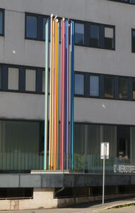 multicolored cylindrical metal columns