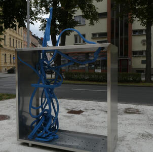 sculpture with tangle of blue cables