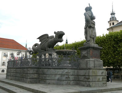 statue of person preparing to slay a dragon