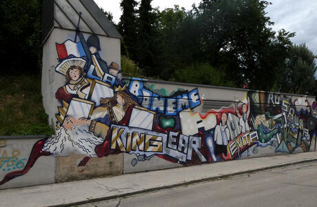 Grafitti with names of plays: La Boheme, King Lear, and Evita