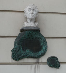 bust of man on building wall