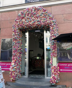 door with arch of flowers