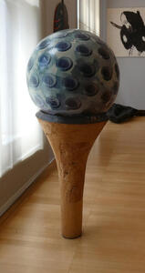 giant golf ball on tee