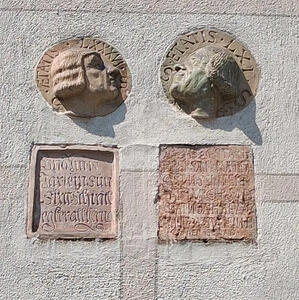 relief of faces on wall